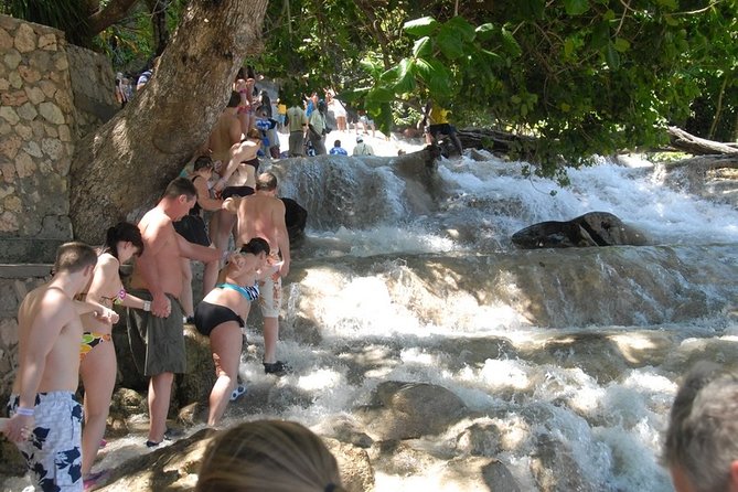 Falmouth Shore Excursion: Dunns River Falls and River Tubing Tour - The top of the falls: market browsing and a little reset