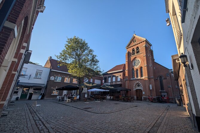 Guided Antwerp Port Tour, in your Car or Minibus - Oosterweel contrast drive: the medieval spire next to Europe’s biggest wharf